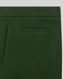 Close-up of green pants with a pocket on a grey background
