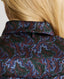 Close-up on back of collar on Model wearing the Birch Print Silk Detachable Tie Neck Blouse in Midnight Blue