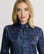 Close-up on model wearing the Birch Print Silk Detachable Tie Neck Blouse in Midnight Blue