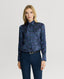 Model wearing the Birch Print Silk Detachable Tie Neck Blouse in Midnight Blue with navy trousers 