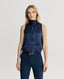Model wearing a midnight blue silk sleeveless top with a neck tie detail and navy trousers 