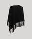 Black poncho with fringe details on a light gray background