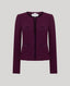 Purple boucle jacket on a light grey background