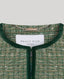 Green textured garment with 'Really Wild London' label on a light gray background