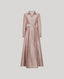 Long pink dress with a belt on a light gray background