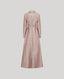 Long pink dress with a belt on a light gray background