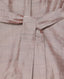 Close-up of a textured fabric with a belt detail