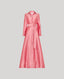 Pink dress with a belt on a light gray background