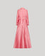 Pink silk dress on a light gray background