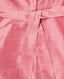 Close-up of a pink fabric with a belt detail