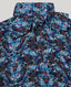 Close-up on fabric with blue, purple, and black butterfly design on maxi dress