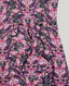 Close-up of a fabric with a pink and black butterfly pattern on a gray background