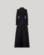 A long black dress , featuring long sleeves, a high collar, and a matching waist belt, shown from the back against a solid gray background.