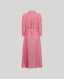 Pink dress with a belt on a light gray background
