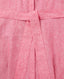 Close-up of a pink textured fabric with a belt