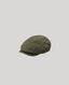 Green tweed field flat cap on grey background 