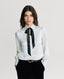 Model wearing Glyndebourne Silk Detachable Tie Neck Blouse in Winter Ivory 