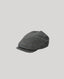 Navy grey flat cap on a light gray background
