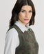 Close-up of model wearing Highgrove Lambswool Jacquard Crew Neck Tank in Loden green 