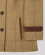 Close-up of a brown and beige windowpane plaid tweed jacket, showing dark brown buttons, a vertical welt pocket, and a matching brown leather tab detail on the sleeve.