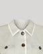 Light sage green jacket with white collar and brown buttons on a light gray background