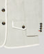 Close-up of a sage green jacket with tortoiseshell buttons and white trim on a light gray background