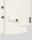 Close-up of a white jacket with tortoiseshell buttons on a light gray background