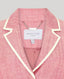 Pink jacket with white trim and 'Really Wild London' label on a gray background