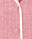 Close-up of a pink textured fabric with buttons