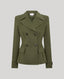 A sage green double-breasted blazer with a notched lapel, structured shoulders, and dark buttons, shown against a solid light gray background.