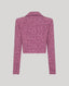 Pink boucle jacket on a light gray background