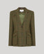 An olive green tweed jacket with a two-button front and flap pockets, displayed on a neutral gray background.