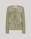 Green suede jacket with a belt on a light gray background