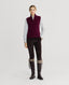 Model wearing Madeline Cashmere Zip Up Tank in Oxblood Burgundy with corduroy trousers and boots 