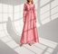 Model wearing blush pink silk gown in a naturally lit studio space