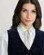 Close-up on the Mayfair Velvet Waistcoat in Midnight Navy Blue with silk blouse 