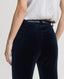 Back of Velvet Trousers in Midnight Navy Blue on model with leather belt and silk blouse