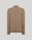 A light brown knit turtleneck sweater shown from the back, displayed on a neutral light gray background.