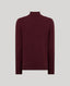 A dark burgundy knit turtleneck sweater displayed on a neutral light gray background.