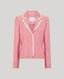 Pink blazer with white trim on a gray background