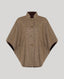 A brown herringbone tweed cape jacket with a high stand collar and three front buttons, displayed on a neutral gray background.