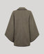 Back of a herringbone patterned jacket in brown and beige tones with dark brown shawl collar trim.