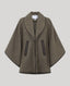 A brown textured wool cape jacket with dark brown trim and zippered pockets, displayed on a neutral light gray background.