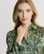 Close-up on Model wearing Oak Print Silk Shirt Dress With Tassel in Green and Cream