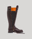 Brown leather boot with a zipper on a light gray background