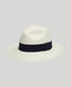 White fedora hat with a navy band on a light gray background