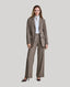 Model wearing Highclere Wool Safari Jacket in Taupe Camel Check with silk blouse 