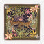 Decorative fabric square with leopards and floral patterns on a dark background
