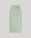 Green patterned skirt on a light gray background