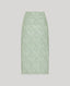 Green patterned skirt on a light gray background
